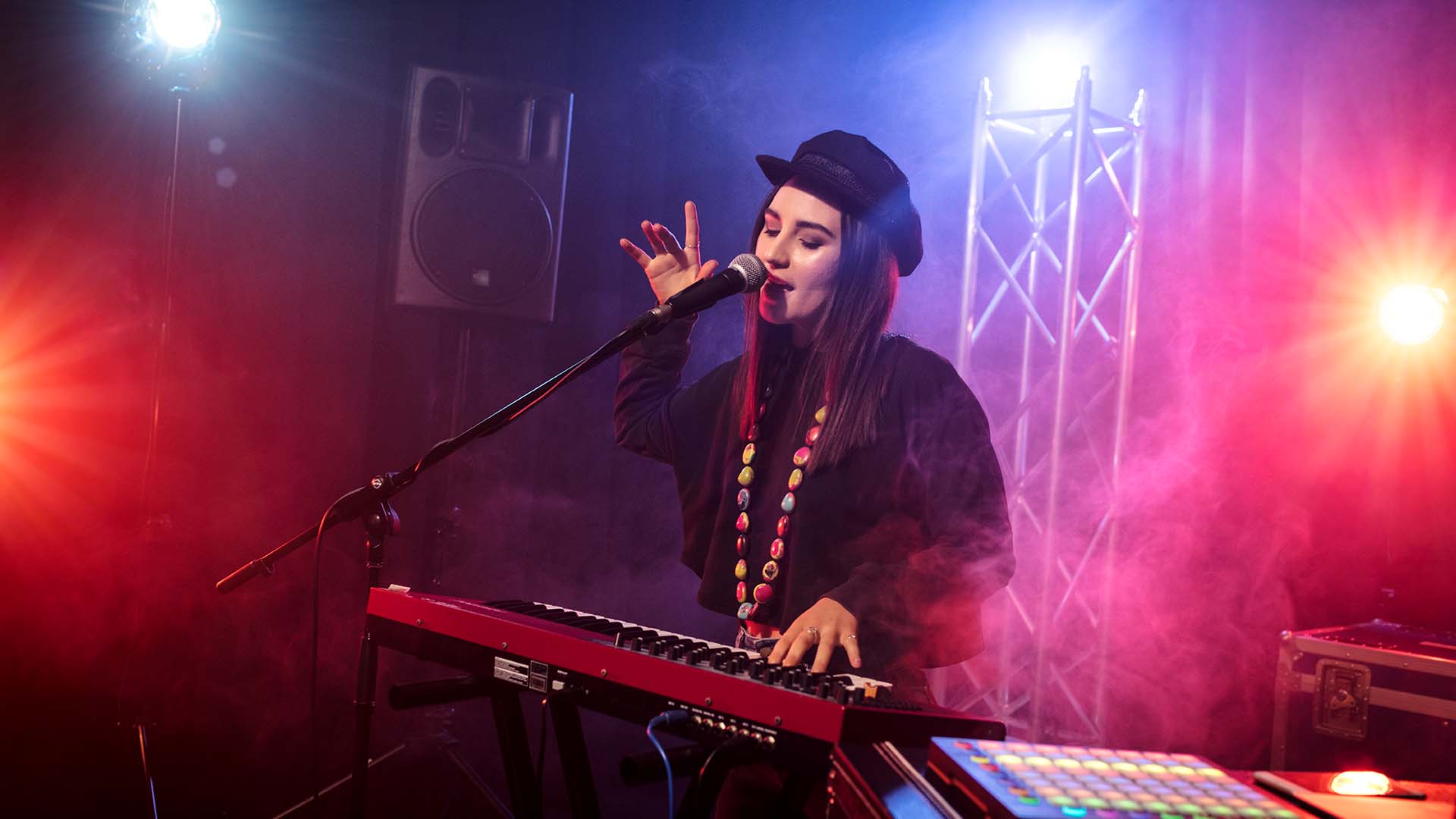 Photograph of student playing the drums in a TAFE Queensland music and recording studio