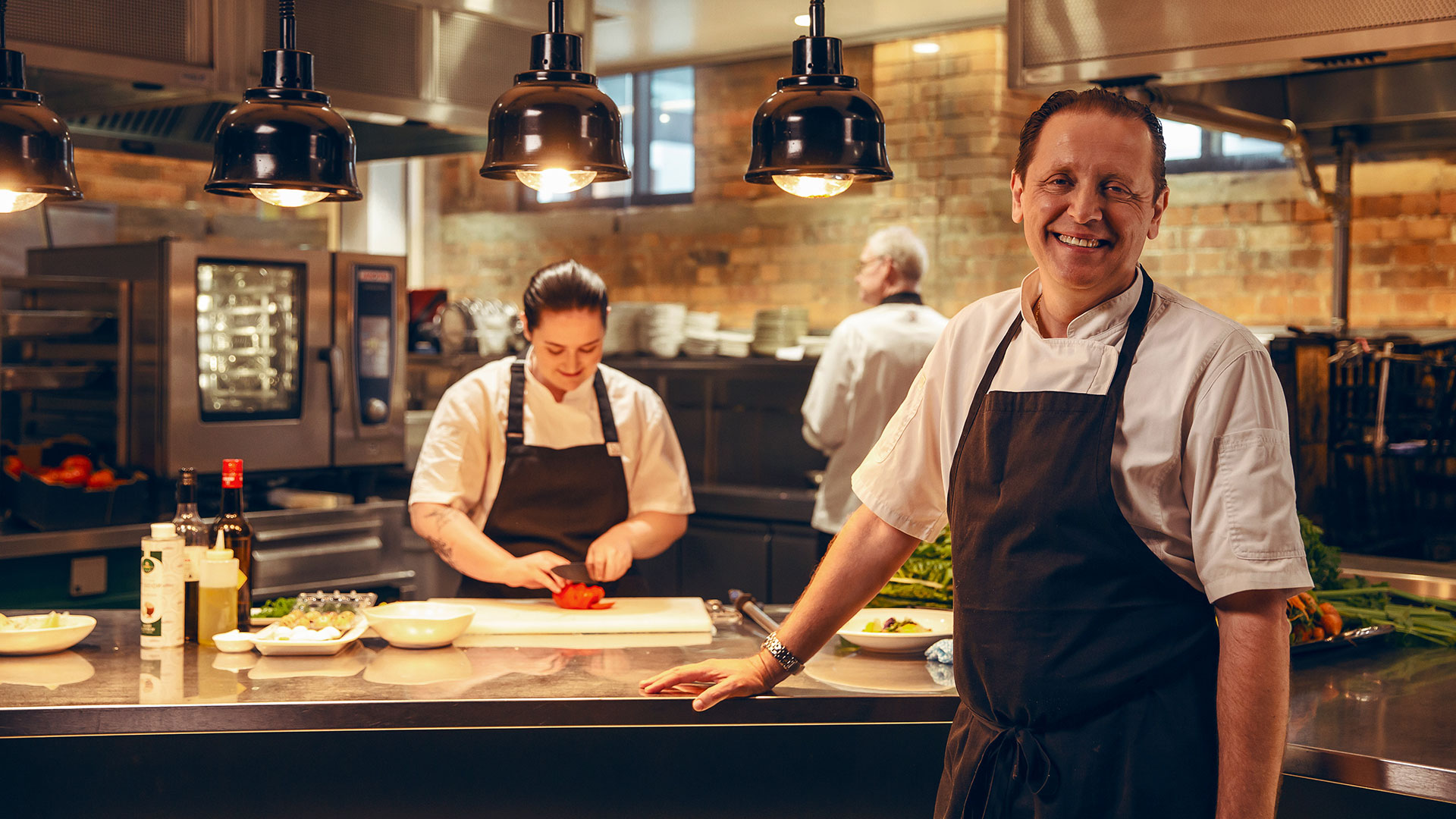 student and teacher laying pipe