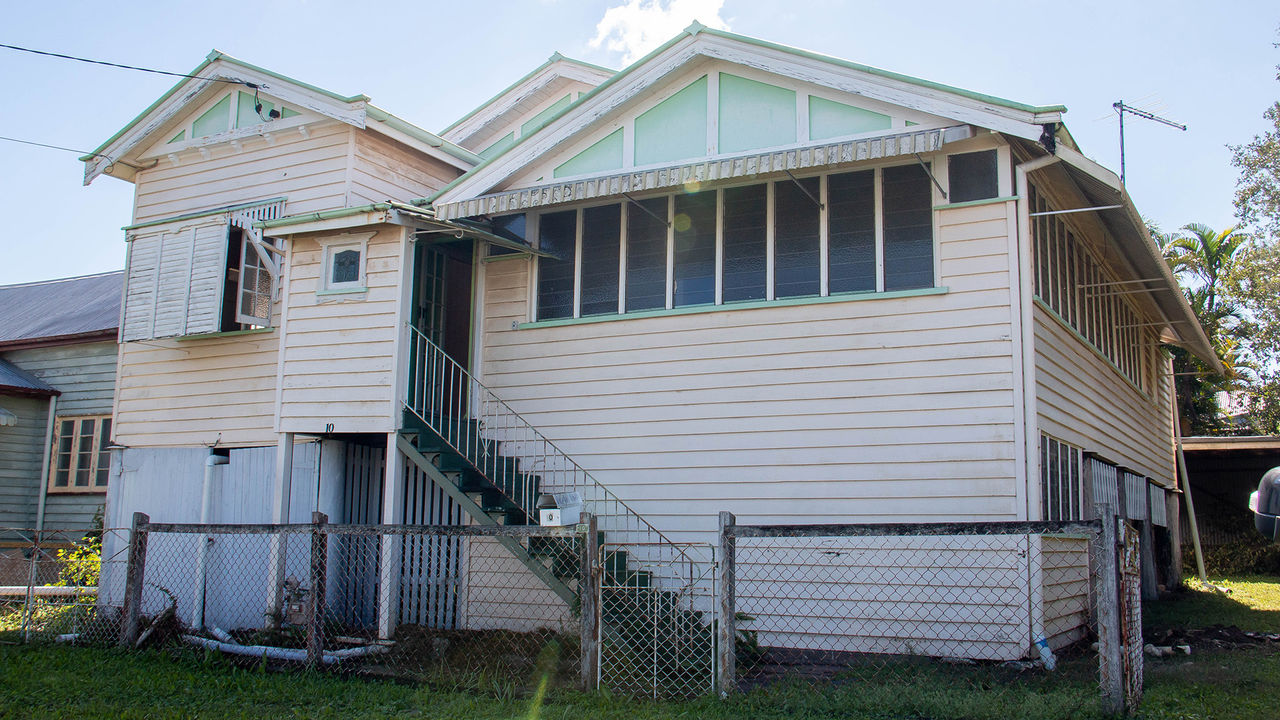 run down Queenslander house