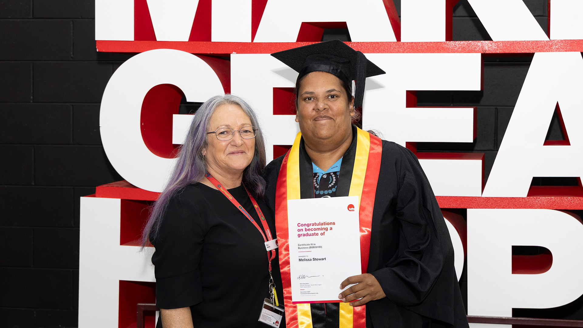 Certificate III in Business (BSB30120) graduate, Melissa Stewart, celebrates with educator Rhee Walsh.