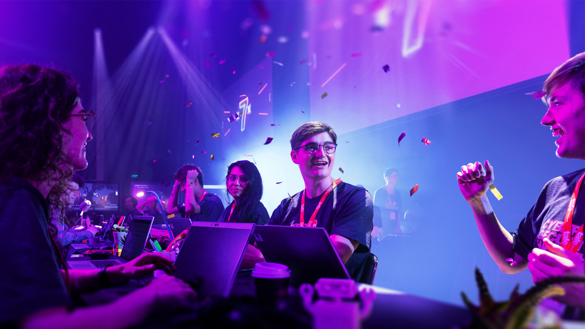 Students complete a hackathon with confetti falling from ceiling