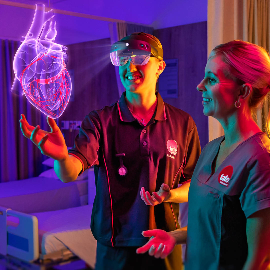 Photograph of a nursing student Zoe Hope working with a hololens heart